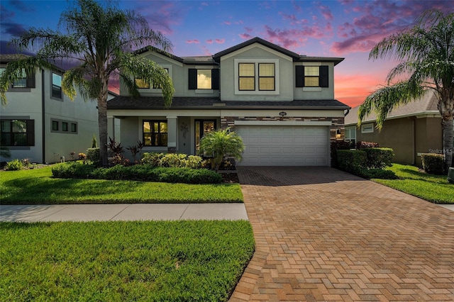 19209 Long Lake Ranch Blvd, Lutz, FL 33558 - traditional-style house with decorative driveway, stucco siding, a garage, and a front lawn
