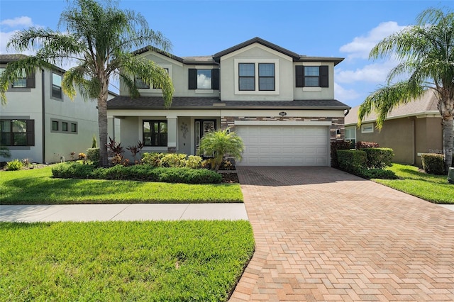 19209 Long Lake Ranch Blvd, Lutz, FL 33558 - view of front facade with decorative driveway, stucco siding, an attached garage, and a front lawn