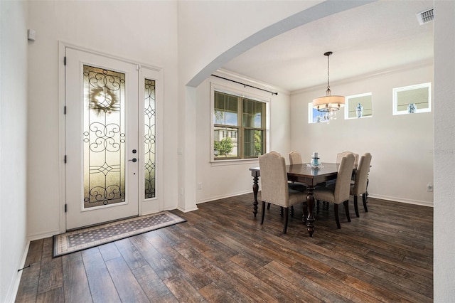 19209 Long Lake Ranch Blvd, Lutz, FL 33558 - entryway featuring dark wood-style flooring, a chandelier, crown molding, and arched walkways
