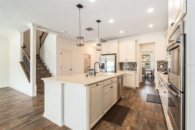 19209 Long Lake Ranch Blvd, Lutz, FL 33558 - kitchen with stainless steel appliances, crown molding, dark wood-style floors, light countertops, and decorative backsplash