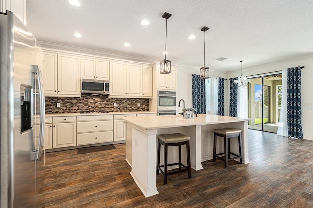 19209 Long Lake Ranch Blvd, Lutz, FL 33558 - kitchen featuring stainless steel appliances, tasteful backsplash, light countertops, dark wood-type flooring, and recessed lighting