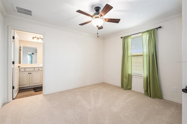19209 Long Lake Ranch Blvd, Lutz, FL 33558 - unfurnished bedroom with light colored carpet, crown molding, connected bathroom, and ceiling fan