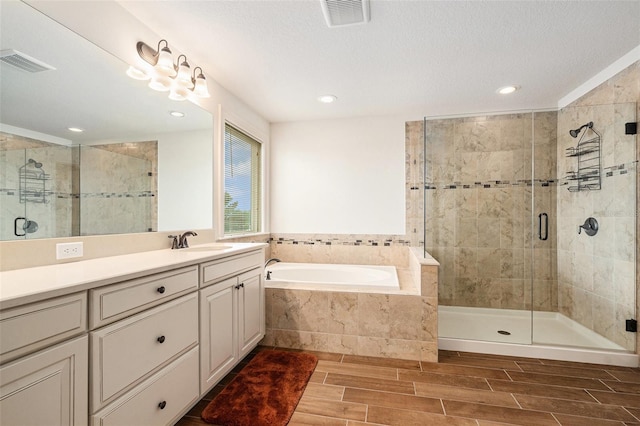 19209 Long Lake Ranch Blvd, Lutz, FL 33558 - full bath featuring a bath, vanity, a shower stall, wood tiled floors, and recessed lighting