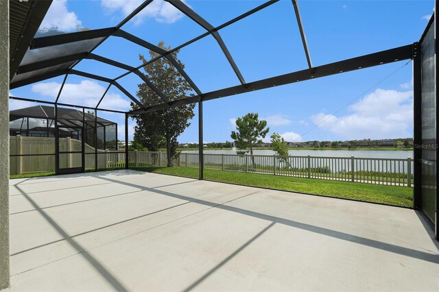 19209 Long Lake Ranch Blvd, Lutz, FL 33558 - fenced backyard with a water view, a patio, and glass enclosure