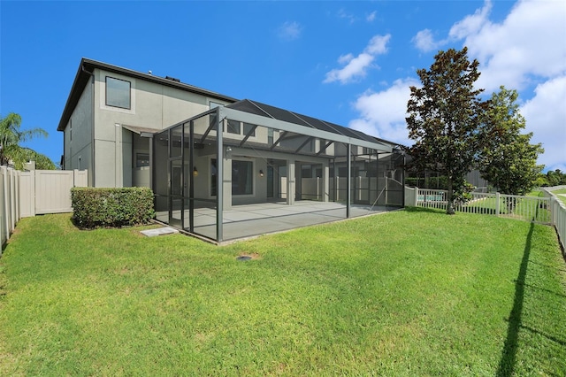 19209 Long Lake Ranch Blvd, Lutz, FL 33558 - rear view of house featuring a fenced backyard, a patio, stucco siding, and glass enclosure