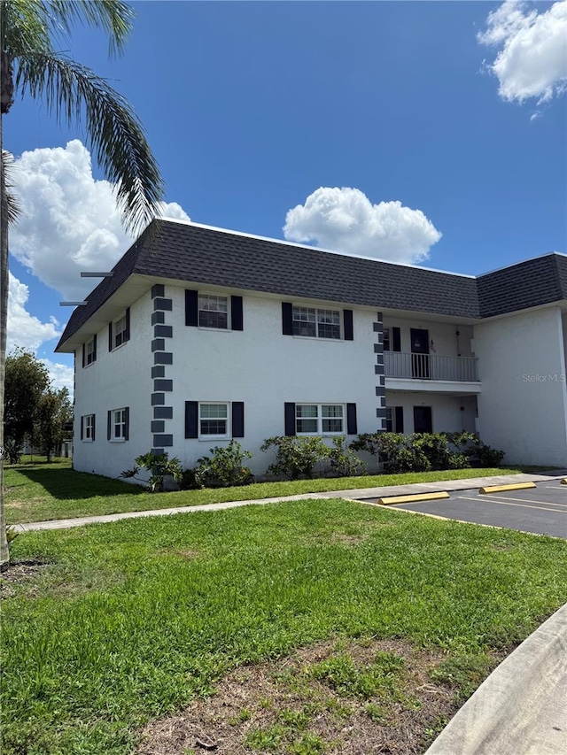 102 47th Avenue Dr W Unit 136, Bradenton, FL 34207 - view of building exterior with uncovered parking