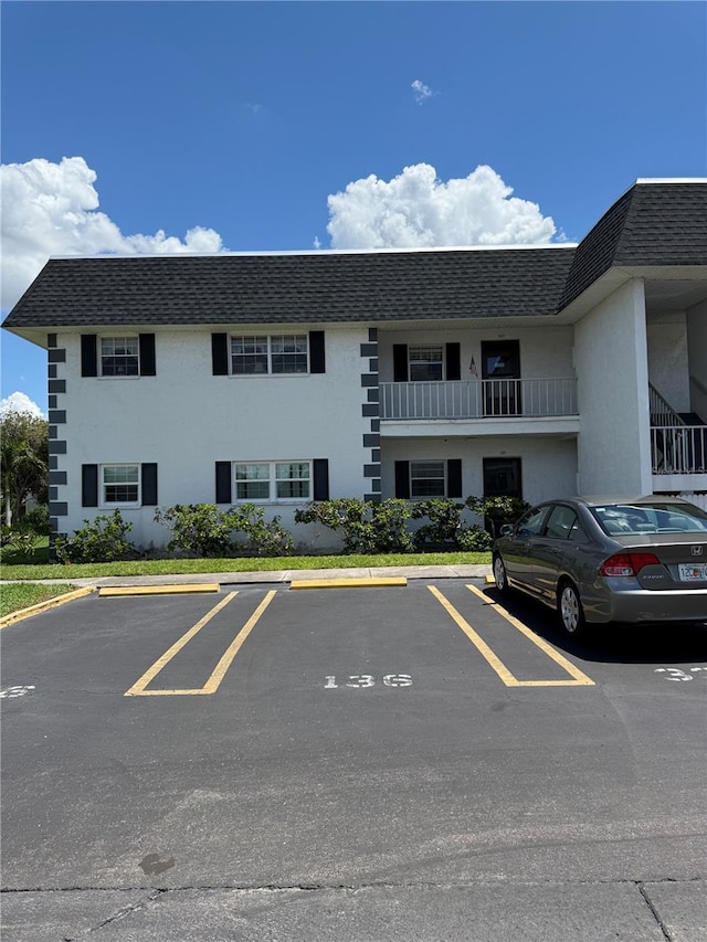 102 47th Avenue Dr W Unit 136, Bradenton, FL 34207 - view of building exterior with uncovered parking