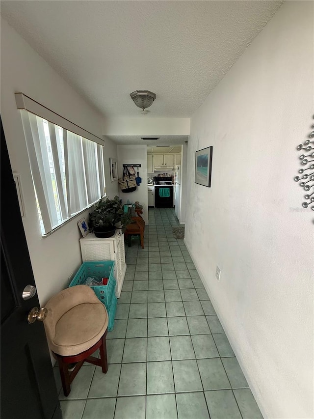 102 47th Avenue Dr W Unit 136, Bradenton, FL 34207 - hallway with light tile patterned floors