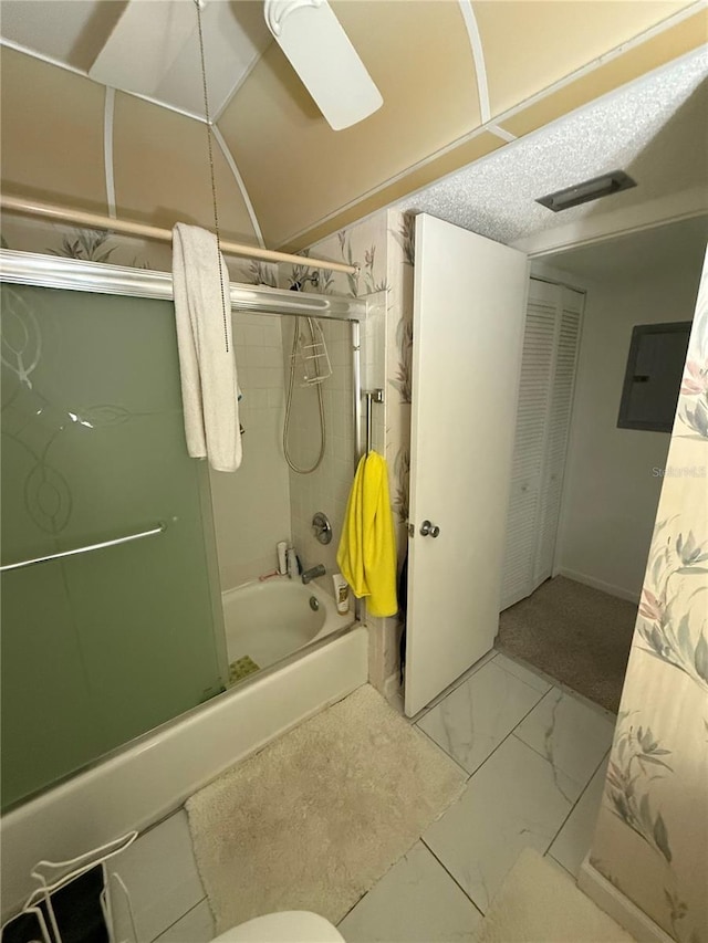102 47th Avenue Dr W Unit 136, Bradenton, FL 34207 - bathroom featuring electric panel, combined bath / shower with glass door, and marble look tile flooring