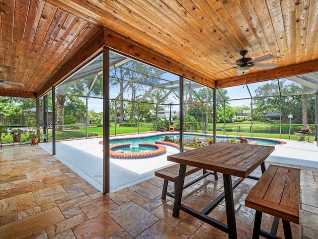4118 Carrollwood Village Dr, Tampa, FL 33618 - sunroom / solarium featuring a hot tub, a swimming pool, ceiling fan, and lofted ceiling