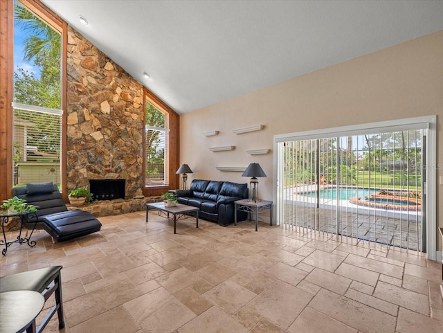 4118 Carrollwood Village Dr, Tampa, FL 33618 - living area with stone tile floors, high vaulted ceiling, and a fireplace