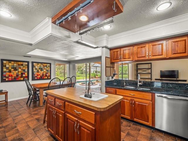4118 Carrollwood Village Dr, Tampa, FL 33618 - kitchen featuring stainless steel dishwasher, a textured ceiling, butcher block countertops, ornamental molding, and a center island