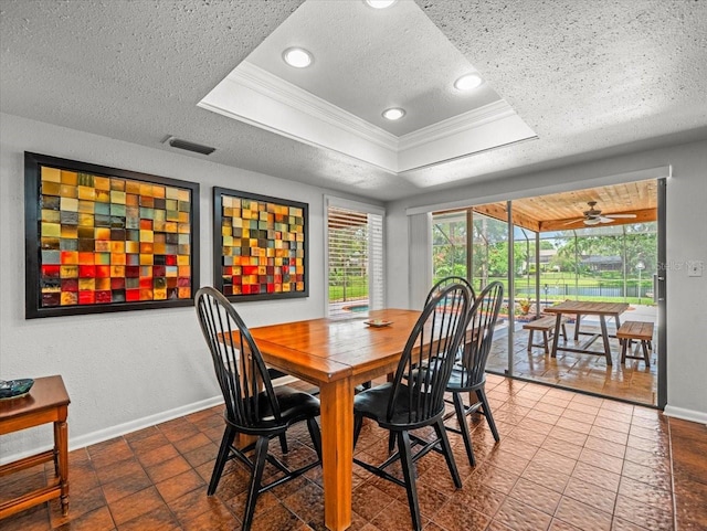 4118 Carrollwood Village Dr, Tampa, FL 33618 - dining room featuring a textured ceiling, ornamental molding, a tray ceiling, ceiling fan, and recessed lighting
