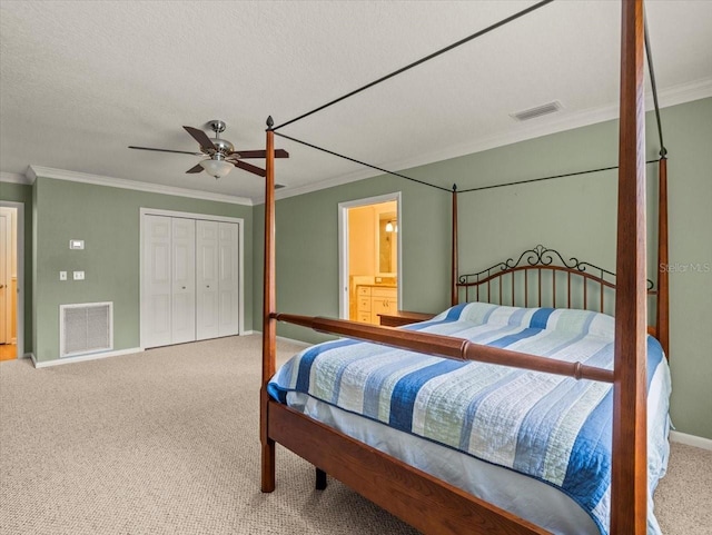 4118 Carrollwood Village Dr, Tampa, FL 33618 - bedroom with carpet floors, ornamental molding, a closet, a ceiling fan, and ensuite bath