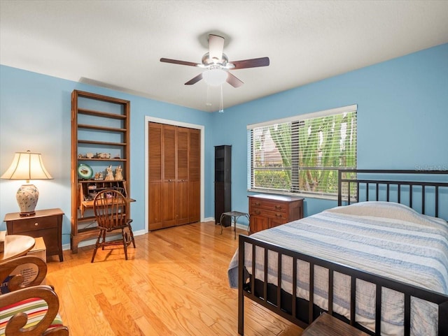 4118 Carrollwood Village Dr, Tampa, FL 33618 - bedroom featuring a closet, light wood-type flooring, and a ceiling fan