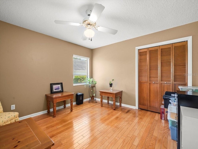4118 Carrollwood Village Dr, Tampa, FL 33618 - office area featuring a ceiling fan, light wood-type flooring, and a textured ceiling