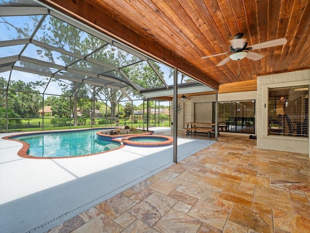 4118 Carrollwood Village Dr, Tampa, FL 33618 - view of swimming pool with ceiling fan, a patio area, a pool with connected hot tub, and glass enclosure