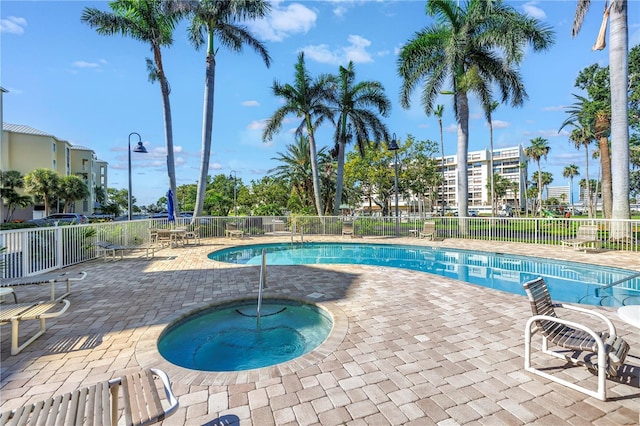 423 150th Ave Unit 1501, Madeira Beach, FL 33708 - community pool with a hot tub and a patio