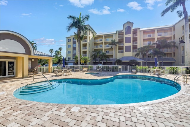 423 150th Ave Unit 1501, Madeira Beach, FL 33708 - community pool featuring a patio