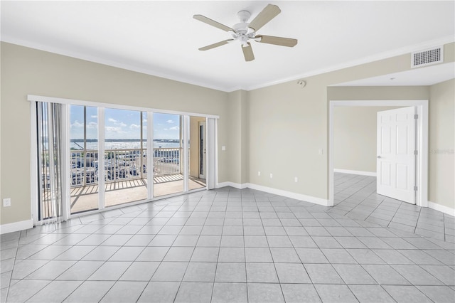 423 150th Ave Unit 1501, Madeira Beach, FL 33708 - spare room with ceiling fan, light tile patterned floors, and ornamental molding