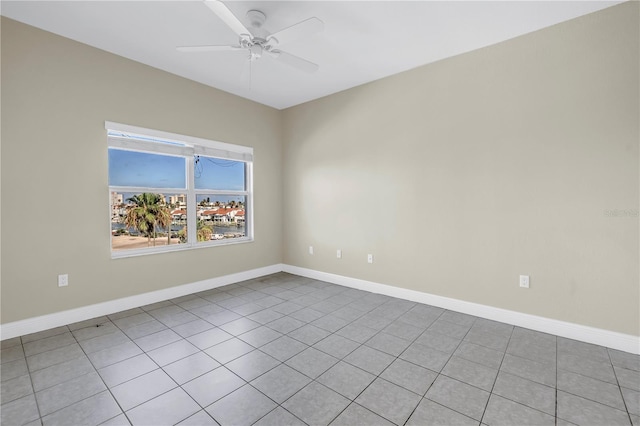423 150th Ave Unit 1501, Madeira Beach, FL 33708 - spare room with a ceiling fan and tile patterned flooring