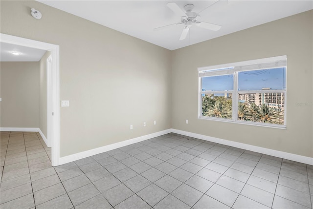 423 150th Ave Unit 1501, Madeira Beach, FL 33708 - empty room featuring a smoke detector, a ceiling fan, and light tile patterned flooring