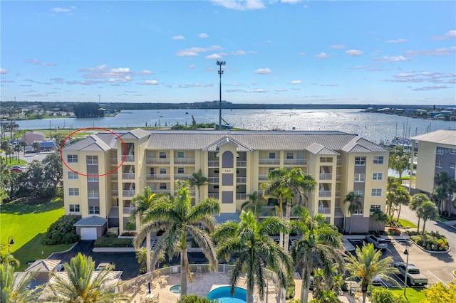 423 150th Ave Unit 1501, Madeira Beach, FL 33708 - drone / aerial view of a nearby body of water and apartment complex