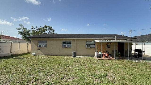 7206 Reindeer Rd, Tampa, FL 33619 - rear view of house with a patio area and cooling unit