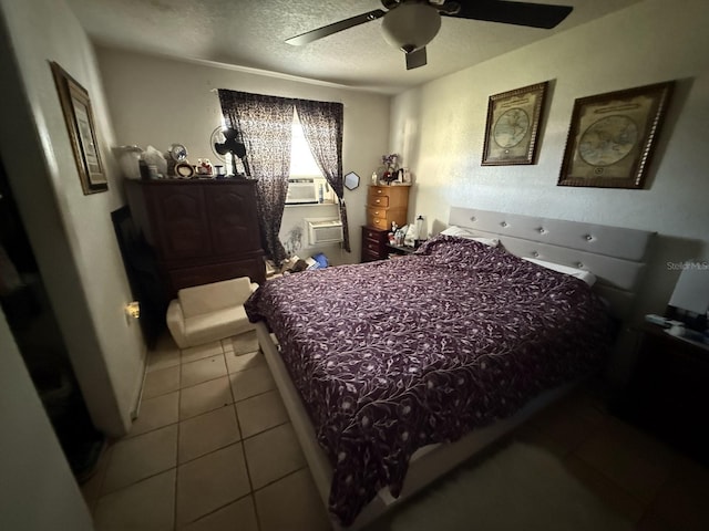 7206 Reindeer Rd, Tampa, FL 33619 - tiled bedroom with a textured ceiling, an AC wall unit, cooling unit, and a ceiling fan