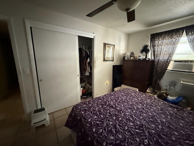 7206 Reindeer Rd, Tampa, FL 33619 - tiled bedroom featuring a closet, cooling unit, and ceiling fan