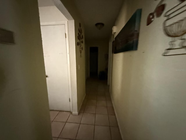 7206 Reindeer Rd, Tampa, FL 33619 - corridor featuring light tile patterned floors