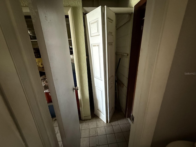 7206 Reindeer Rd, Tampa, FL 33619 - hall featuring light tile patterned floors