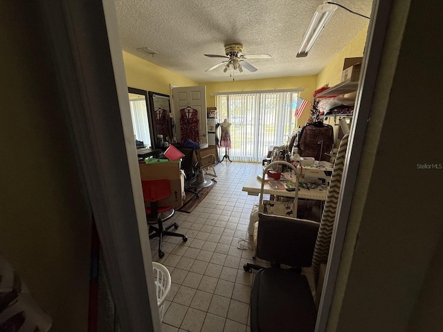 7206 Reindeer Rd, Tampa, FL 33619 - bedroom featuring access to exterior, tile patterned floors, a textured ceiling, and ceiling fan