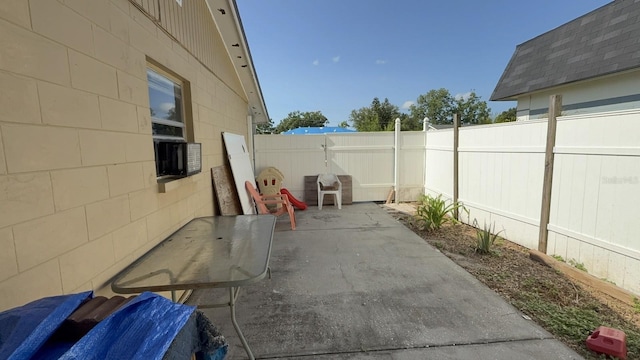 7206 Reindeer Rd, Tampa, FL 33619 - fenced backyard with a patio