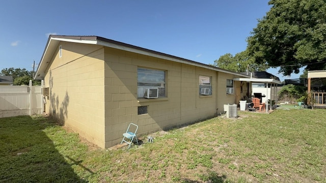 7206 Reindeer Rd, Tampa, FL 33619 - view of side of property featuring cooling unit