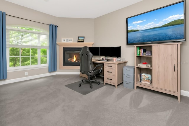 6513 Sand Shore Ln, New Port Richey, FL 34652 - office area featuring light carpet and a glass covered fireplace