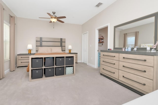 6513 Sand Shore Ln, New Port Richey, FL 34652 - bedroom with light colored carpet and a ceiling fan