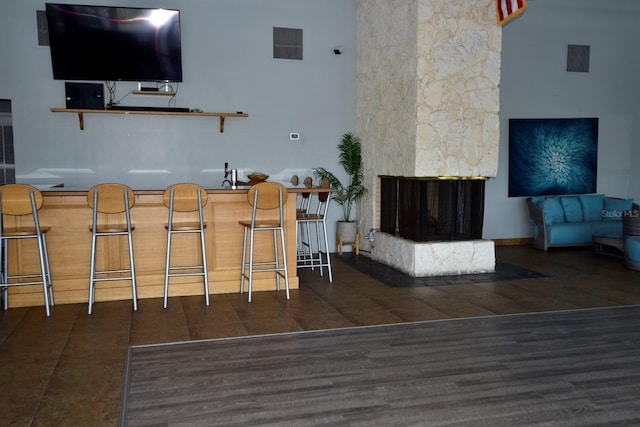 6513 Sand Shore Ln, New Port Richey, FL 34652 - living room featuring a stone fireplace and wood finished floors