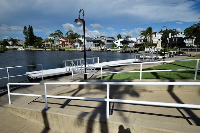 6513 Sand Shore Ln, New Port Richey, FL 34652 - dock area with a residential view and a water view