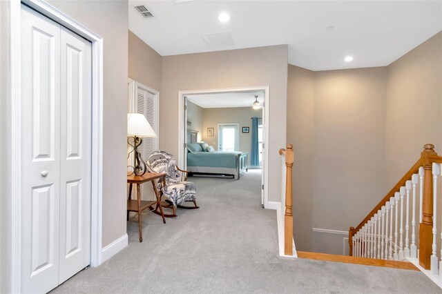6513 Sand Shore Ln, New Port Richey, FL 34652 - hall featuring an upstairs landing and carpet flooring