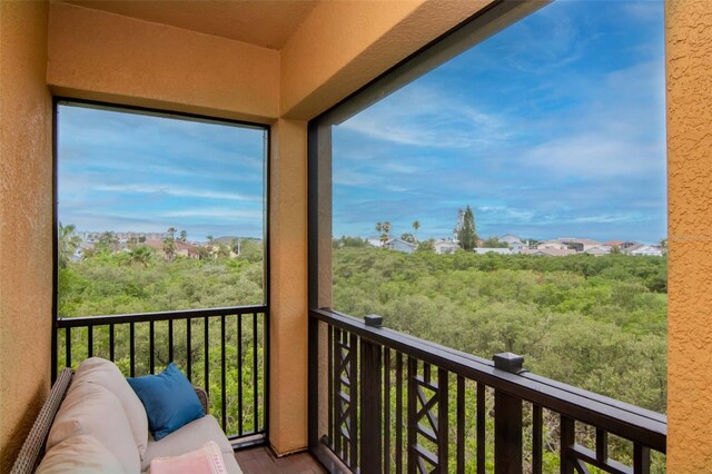 6513 Sand Shore Ln, New Port Richey, FL 34652 - balcony featuring a sunroom