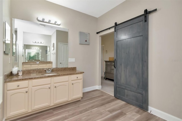 6513 Sand Shore Ln, New Port Richey, FL 34652 - full bath featuring vanity and wood finished floors
