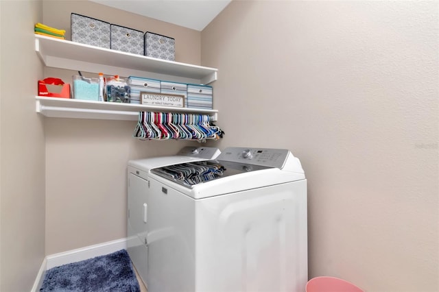 6513 Sand Shore Ln, New Port Richey, FL 34652 - washroom with washer and dryer and baseboards