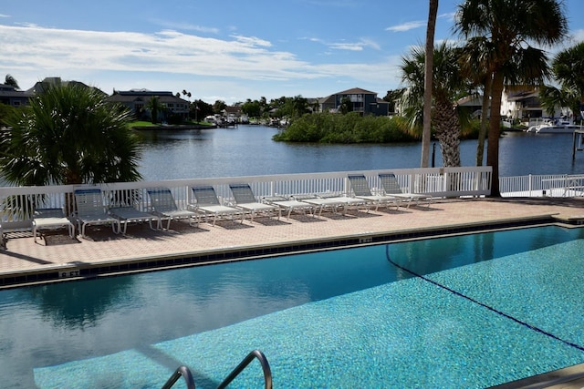 6513 Sand Shore Ln, New Port Richey, FL 34652 - community pool with a patio area, a water view, and a residential view