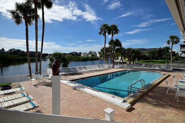6513 Sand Shore Ln, New Port Richey, FL 34652 - community pool featuring a patio and a water view