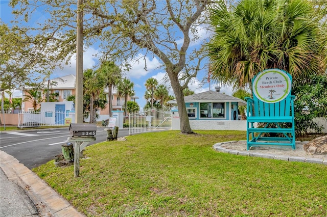 6513 Sand Shore Ln, New Port Richey, FL 34652 - view of community featuring a gate and uncovered parking