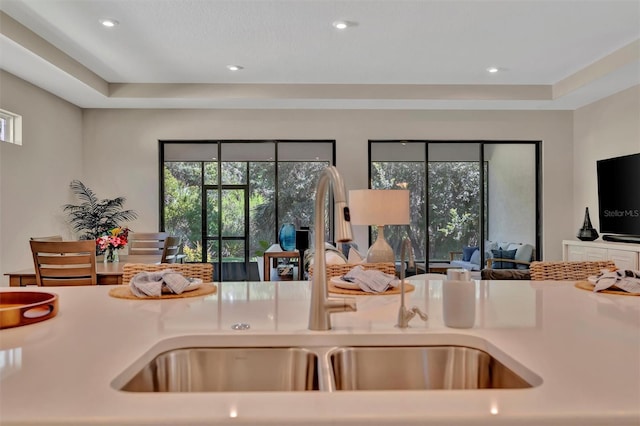 5320 Morey Farms Loop, Palmetto, FL 34221 - kitchen featuring open floor plan, light countertops, a tray ceiling, and recessed lighting