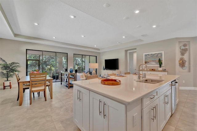 5320 Morey Farms Loop, Palmetto, FL 34221 - kitchen with a tray ceiling, light tile patterned floors, light countertops, white cabinetry, and recessed lighting