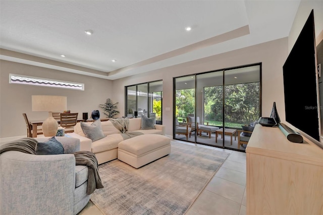 5320 Morey Farms Loop, Palmetto, FL 34221 - living room featuring a raised ceiling, light tile patterned floors, and recessed lighting