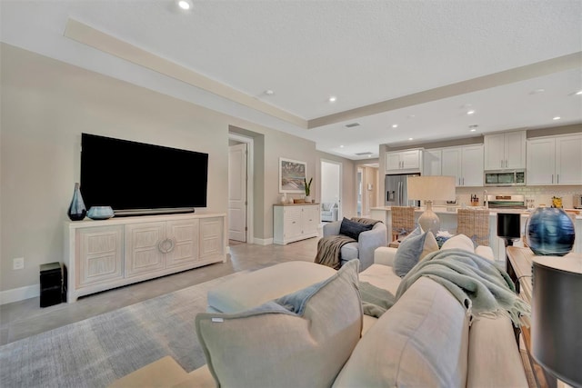 5320 Morey Farms Loop, Palmetto, FL 34221 - living room with baseboards and recessed lighting